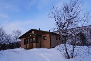 Our 5-star cottage (Above); Norway opposite the holiday village across Teno River (Right)